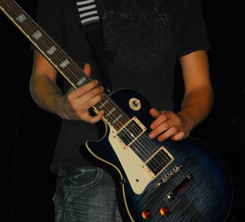playing an electric guitar